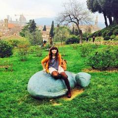 Girl sitting on a statue