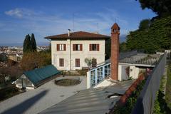 Greenhouses in Giardino delle Rose with blooming flowers and lush greenery