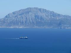 Scenic view of the Strait of Gibraltar with a ship sailing, seen from a viewpoint between Algeciras and Tarifa