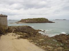 aerial view of Saint Malo with historic buildings along the coastline and sandy beaches