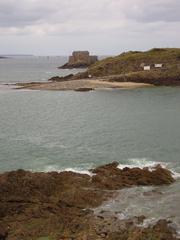 Panoramic view of Saint Malo, France with boats docked and historic buildings in the background.