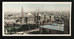 Close-up of mosque with garden in front and three minarets