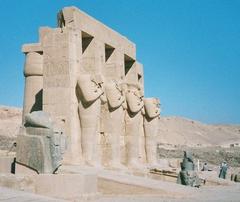 View of the Ramesseum temple ruins in Egypt with grand columns and statues