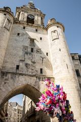 Grosse Horloge building with balloons in the sky