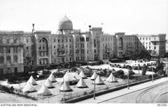 Heliopolis Palace Hotel in 1915 with army tents and ambulance wagons in the foreground