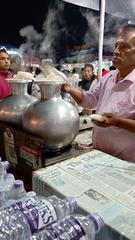 Man making Bhapa Pitha at Cooch Behar Ras Mela 2023