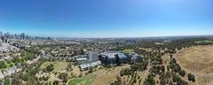 Aerial panorama of Royal Park with Melbourne skyline on the horizon