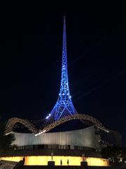 The Theatres Building at Arts Centre Melbourne with spire illuminated in blue