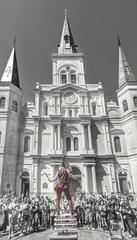 street performer balancing a chair on his chin at Jackson Square, New Orleans