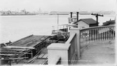 New Orleans 1900, view across Mississippi from Algiers section with landmarks St. Louis Cathedral and Jackson Brewery.