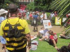 March Against Monsanto protest in New Orleans with bee and fruits signage