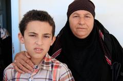 Nayfa and her grandson at IRC clinic in Ramtha, Jordan