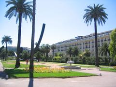 Main esplanade of Jardin Albert 1er with Bernar Venet's arc in the background in Nice