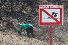 Chief Editor of Russian Information Agency RIA Novosti Svetlana Mironyuk cleaning at Media Subbotnik event in Neskuchny Garden