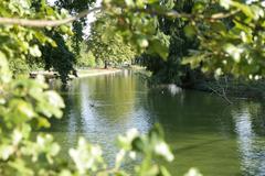 Public garden in Bordeaux with a pond and surrounding trees