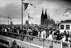 Crowd crossing newly inaugurated Rheinbrücke in Cologne, 1948