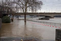 Flooded river bank in Cologne with Deutzer Brücke and Rhine River, January 2018