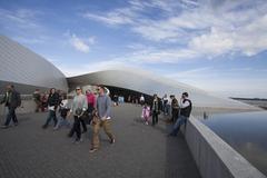 The Blue Planet National Aquarium near Copenhagen with visitors outside the building