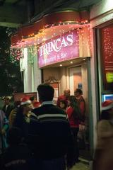 crowd in front of Trincas Bar on Park Street during Christmas celebration