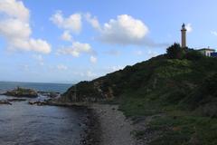 Punta Carnero coastline in Algeciras, Andalusia, Spain featuring Punta Carnero Lighthouse and Mozilla stone at its base