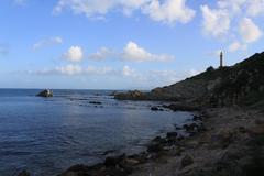 Punta Carnero coastline with lighthouse and Cabrita Island in the background