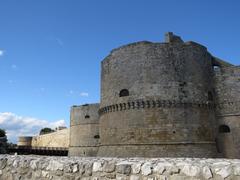 Castello Aragonese in Otranto, Italy at sunset, featuring the south and west towers.