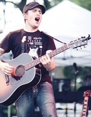 Musician Jason Reeves performing onstage