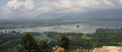 Scenic view of Dal Lake in Srinagar with boats and mountains in the background