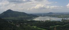 Scenic view of Dal Lake with mountains in the background