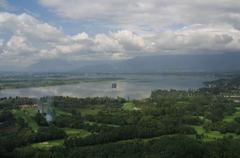 Dal Lake in Srinagar with scenic mountain views and Shikara boats