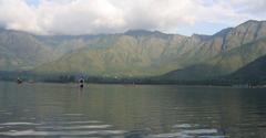 Scenic view of Dal Lake in Srinagar with mountains in the background