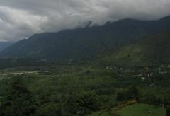 Beautiful view of Dal Lake with houseboats and mountains in the background