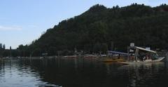 Scenic view of Dal Lake in Srinagar with houseboats and mountains