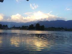 Evening view of Dal Lake in Kashmir with a shikara boat