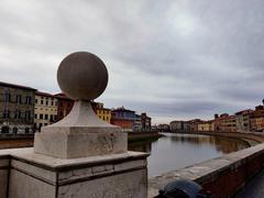 Lungarno in Pisa featuring the Arno River with historical buildings on both sides