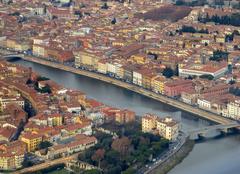 Aerial view of Pisa with Arno River and Fortezza Bridge in the foreground