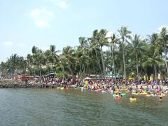 Festival Beach in Ancol Jakarta with people enjoying the beachside activities under clear blue skies