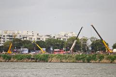 Crane machines along Tankbund submerging Ganesh statues