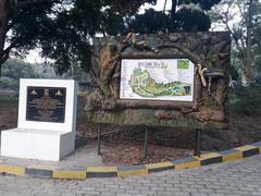 view of a zoo with visitors walking and animals in enclosures