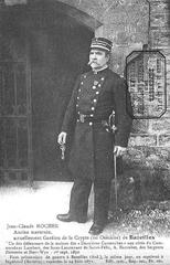 Jean Claude Rocher, one of the Bazeilles battle survivors, standing in front of the Bazeilles cemetery crypt