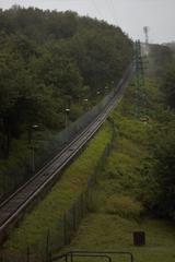 funicular in a foggy mountainous landscape