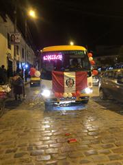 Transport truck in Cusco carrying the Peruvian flag