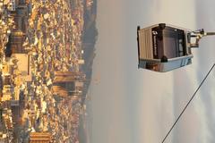 Panoramic view of Barcelona, showcasing the city's buildings, streets, and coastline