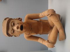 Sculpture of a seated man appearing to sing, made of clay from central Veracruz, Late Classic period 600-900 AD