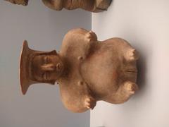 ancient pre-Hispanic clay sculpture in solemn pose