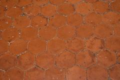 hexagonal terracotta tiles on a museum floor