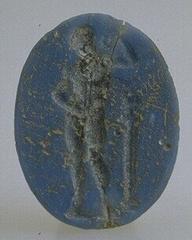 engraved male figure on blue glass