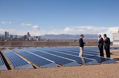 President Barack Obama speaks with CEO of Namaste Solar Electric, Inc., Blake Jones, while looking at solar panels in Denver, February 17, 2009