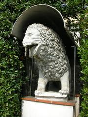 Stone lion statue in the garden of Museo Nazionale di Villa Guinigi