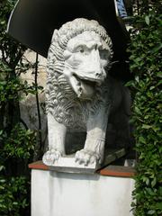 stone lion statue in the garden of Museo Nazionale di Villa Guinigi